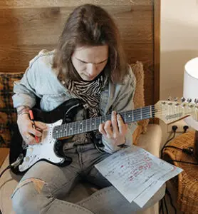 guitar-training-studio guy practicing guitar